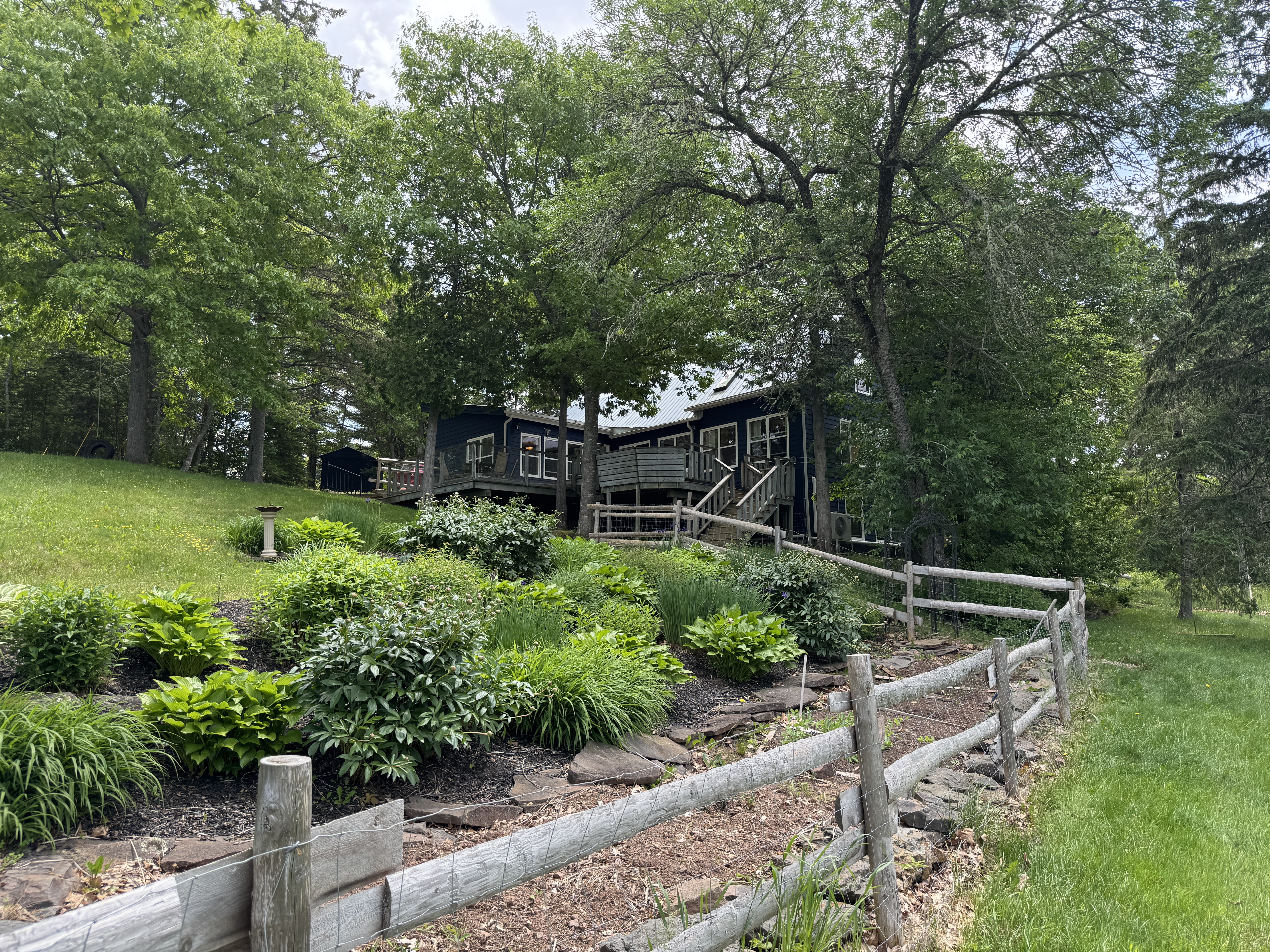 Exterior spring view of east coast waterfront home